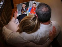 William Tyrrell's foster parents, above with pictures of the boy, took him into care in March 2012.