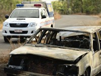 The remains of a burnt out car belonging to three German backpackers who were kidnapped, beaten and robbed while camping in the Northern Territory last August.